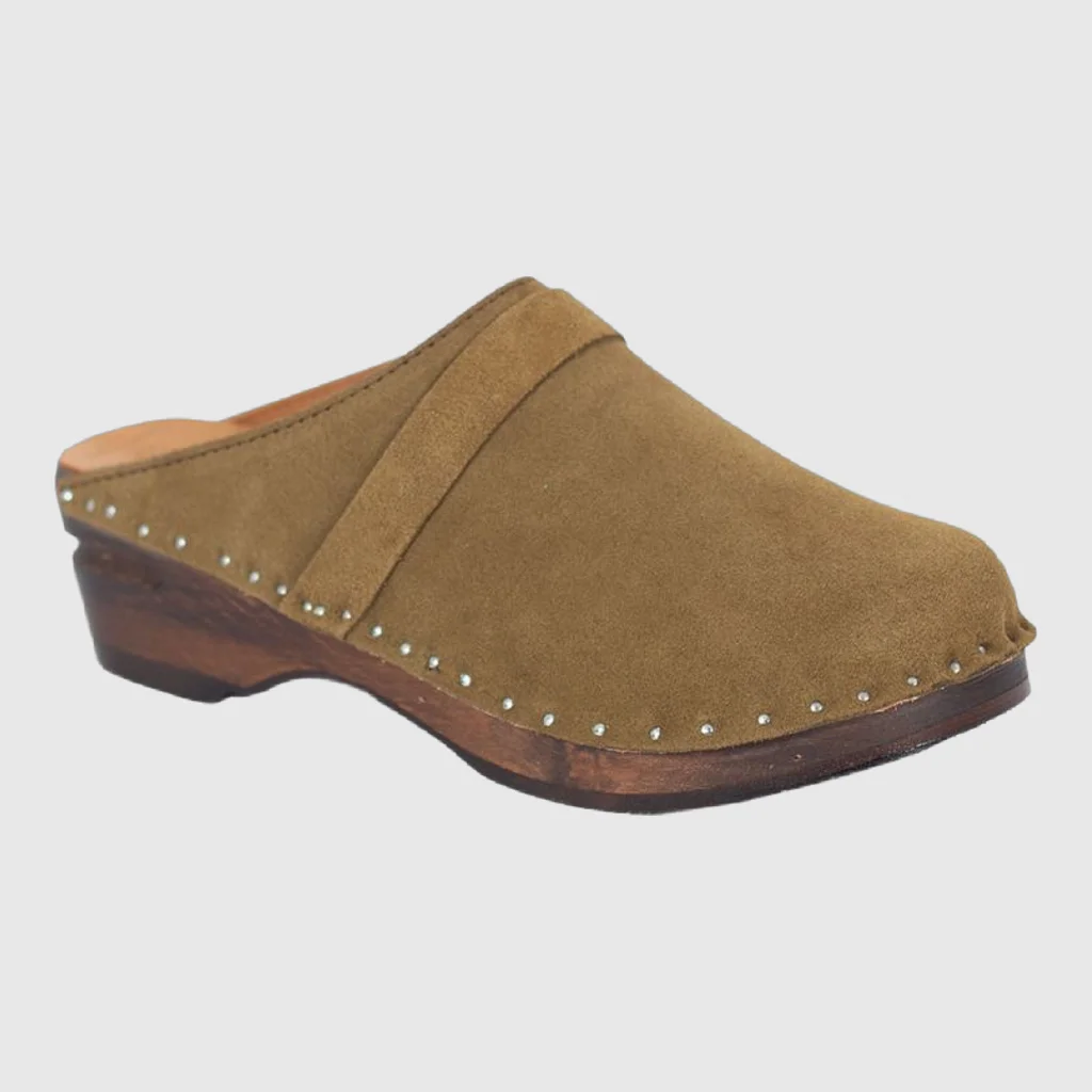 Suede clog photographed on a plain studio background