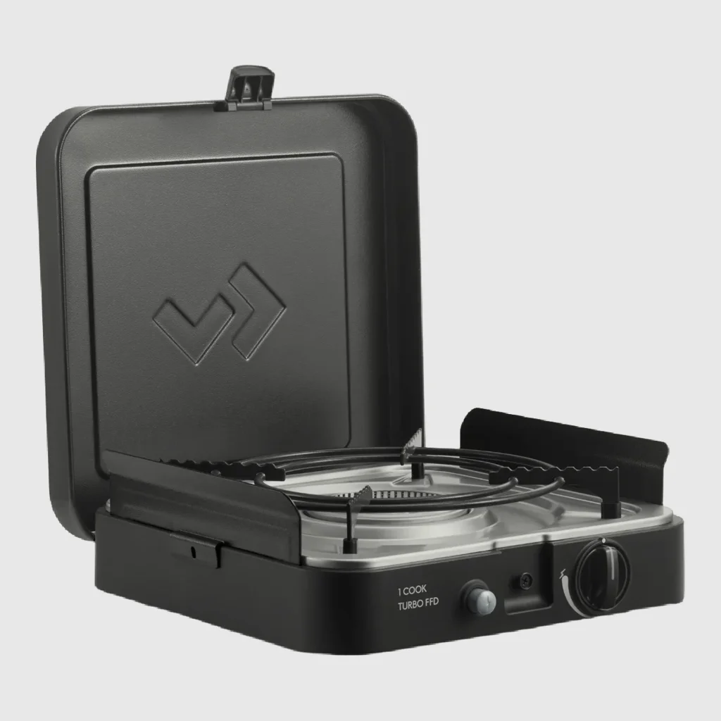 Portable camping stove photographed on a plain studio background